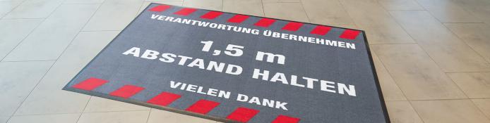 Rutschfeste Fußmatte Corona Abstand halten für COVID-19 Abstandsregeln